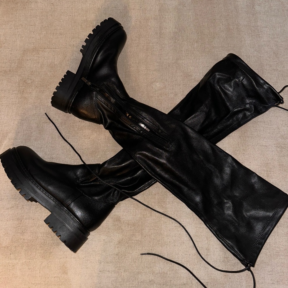 Over the knee black lug boots